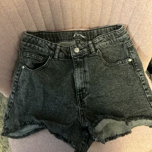 black denim shorts with frayed hem
